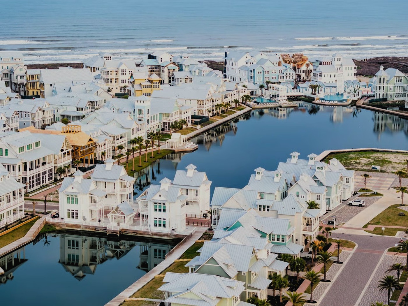 Pastel coastal cottages and canals along the Texas gulf coast