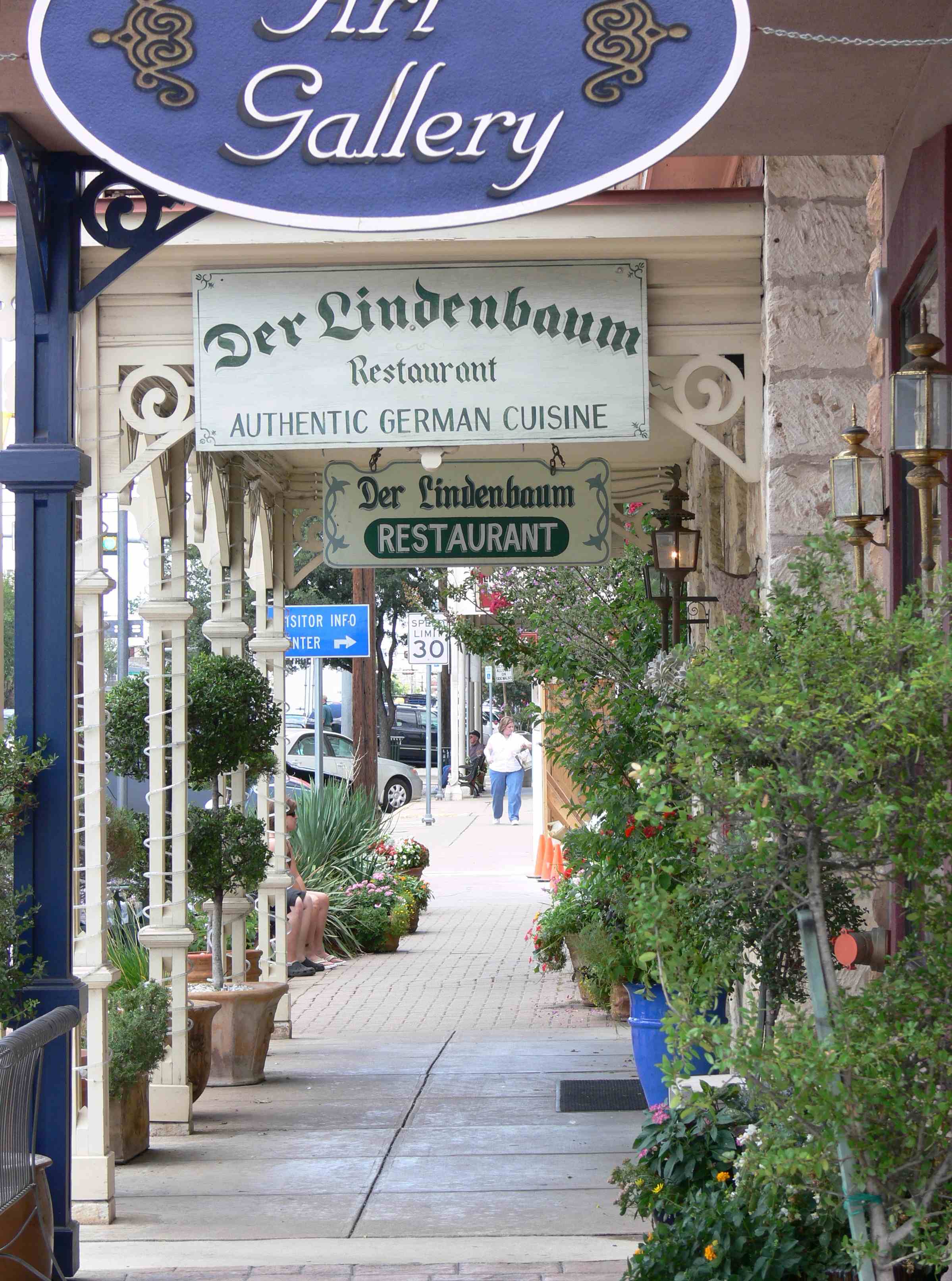Historic limestone and brick storefronts along Main Street in Fredericksburg, Texas